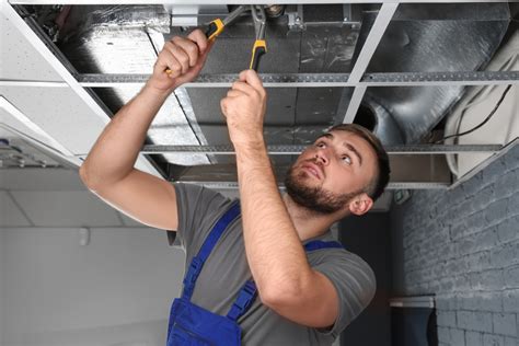 Local Hvac Technician Repairing Air Conditioner Indoors Protocall