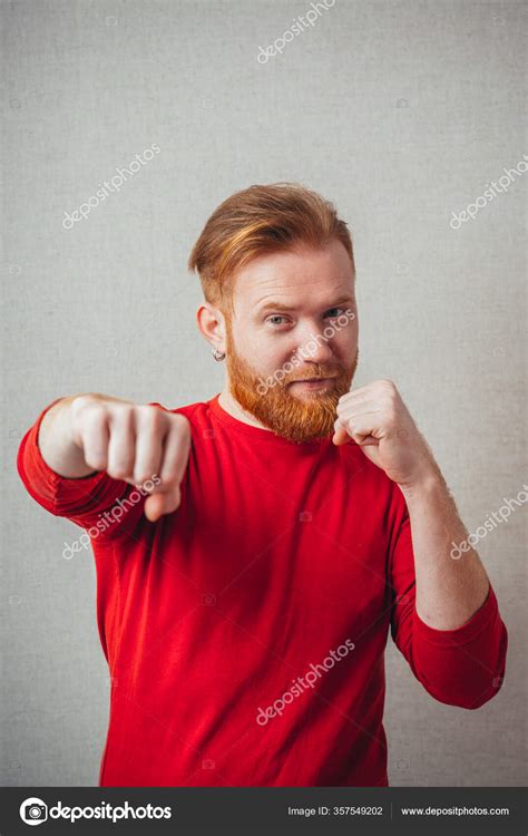 Portrait Angry Young Man Clenching His Fist Stock Photo By ©file404