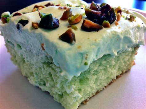 1 carton (8 ounces) frozen whipped topping, thawed; Pistachio Cake Recipe