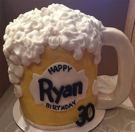 A Birthday Cake Made To Look Like A Beer Mug With Whipped Cream On The Top