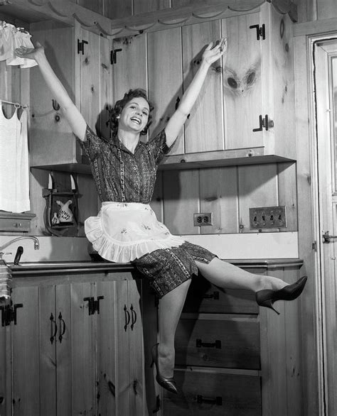 1960s 1950s housewife sitting on knotty photograph by vintage images pixels