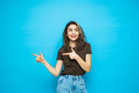 Trendy Attractive Young Woman Pointed Side Over Blue Background Stock