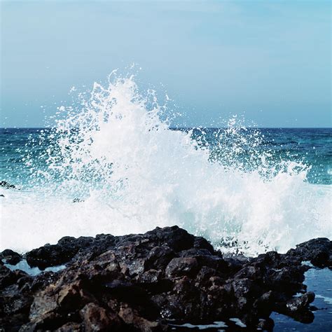 Wave Crashing Against Rock Photograph By Johner Images Pixels