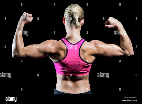 Muscular Woman Flexing Her Arms Stock Photo Alamy