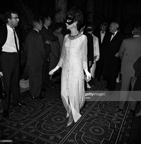 A Masked Gloria Guiness Arriving At Truman Capotes Black And White