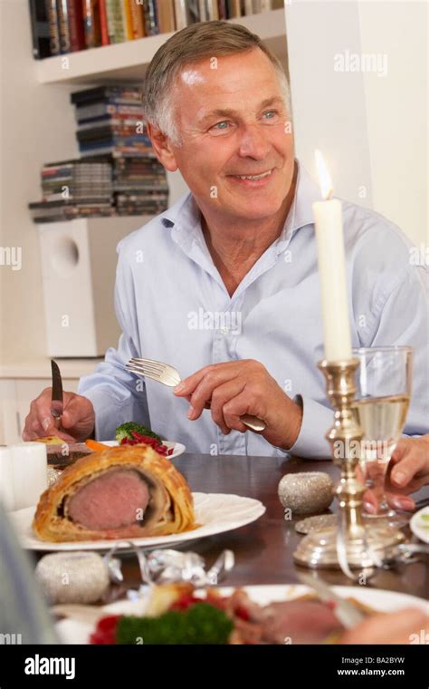 Man Eating Dinner At Home Stock Photo Alamy