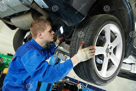 Auto Mechanic At Car Brake Shoes Eximining Stock Photo Image Of