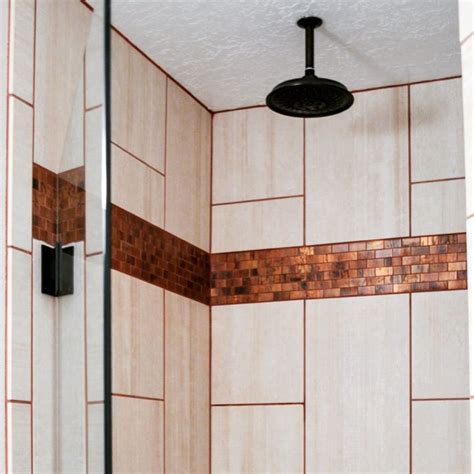 This Shower S Copper Backsplash And Grout Paired With Light Vertical