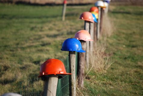 Hard Hat These Hard Hats Are Put On The Poles Of A Field B Flickr