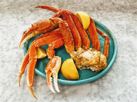 These baked crab legs are easy to make and packed with delicious flavors of garlic, lemon, and a cajun seasoning. Easy Baked Crab Legs | Recipe in 2020 | Baked crab legs, Cooking, Crab legs