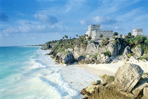 The Ruins Of Tulum Preside Over A Rugged Coastline A Strip Of