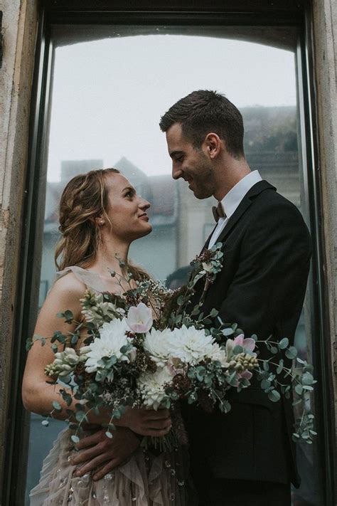 Beautiful Moody Wedding Portrait Of Bride And Groom Holding A Big Rustic Wedding Bouquet