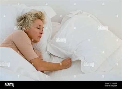 One Mature Woman Only Asleep In Bed Hi Res Stock Photography And Images