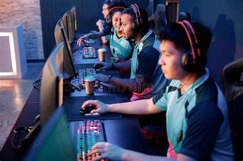 Cybersport Team Participating In Online Tournament In Gaming Club Stock