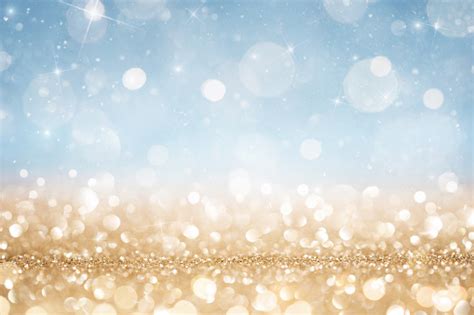 Abstract Defocused Gold And Blue Glitter Background Stock Photo