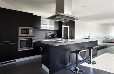 Modish Kitchen Featuring Black Kitchen Counter And Island With A Modish