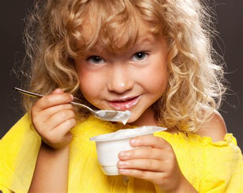 Little Girl Eating Yogurt Stock Photo By ©tatyanagl 6135783