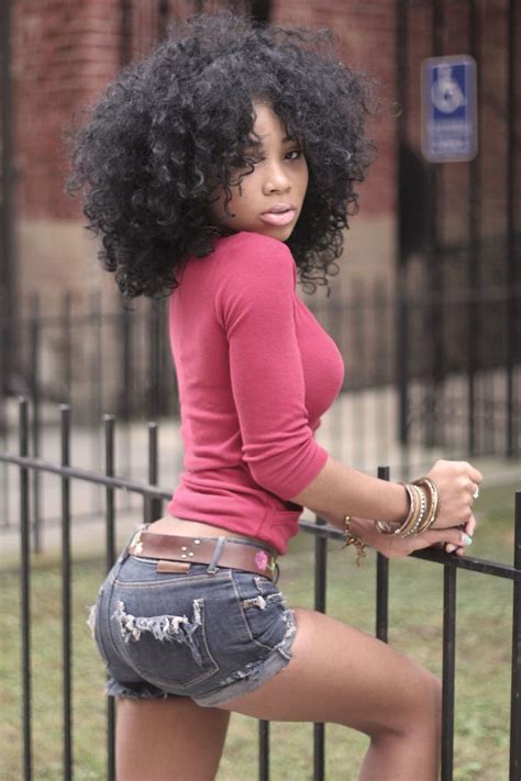 Ebony Girl Wears Denim Shorts A Pink Top And Has Curly Hair Natural