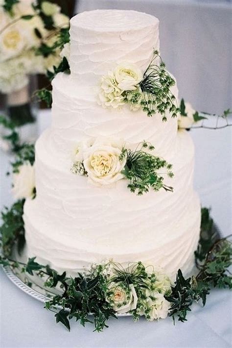 Simple Romantic White Buttercream Wedding Cake With Roses And Greenery