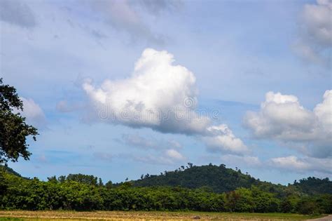 White Fluffy Cloud Over Green Hill Autumn Or Summer Countryside