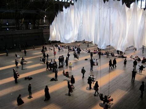 Large White Curtains Hang From The Ceiling Of The Park Avenue Armory