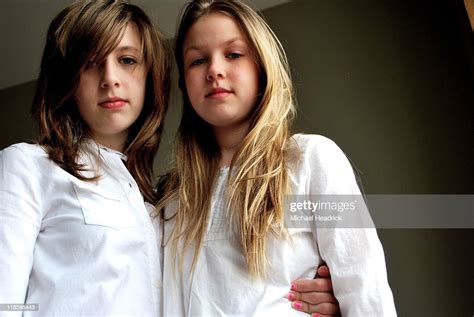 Sisters Two Loving Girls With Beige Background Photo Getty Images