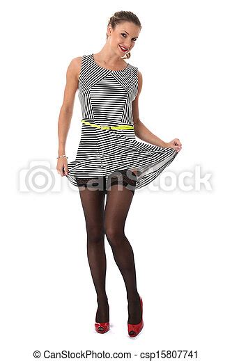 Model Released Sexy Young Woman Raising Skirt Showing Stocking Tops Canstock