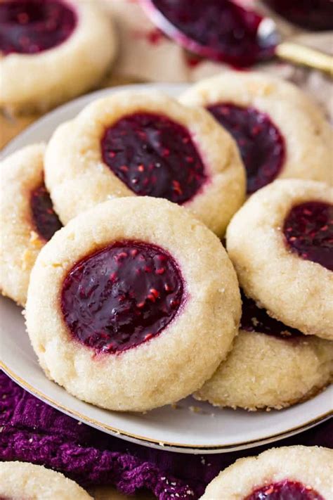 Thumbprint Cookies Rolled In Sugar And Filled With Raspberry Jam