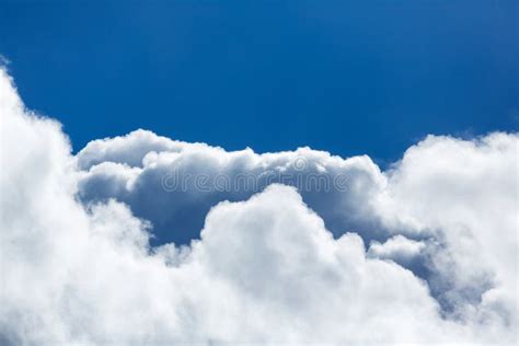 Blue Sky Covered In Large Puffy Cumulonimbus Cloud Formations Stock