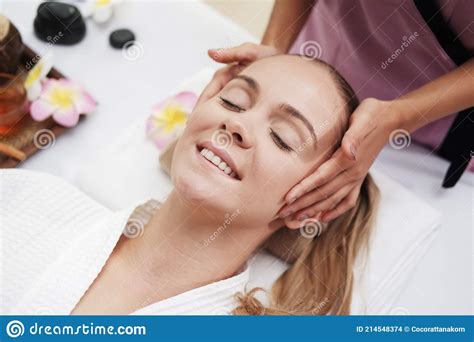 Asian Massage Therapist Woman Is Making Traditional Head And Facial