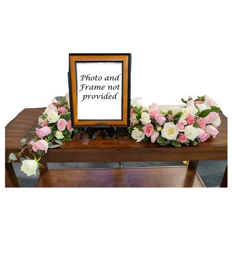 Pink And White Rose S Shaped Urn Surround By Flower A Day