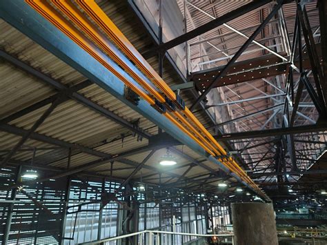 Energy Supply Of Two Bridge Cranes Working In Steel Mills Slt