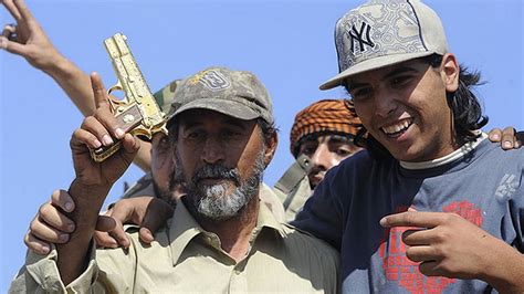 Confirmed Gaddafi Dead Dictators Prized Golden Gun Paraded In Streets Mirror Online
