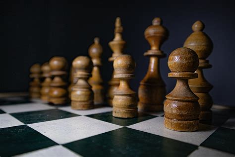 Wooden Chess Pieces on a Chess Board · Free Stock Photo