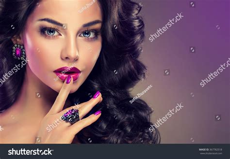 Model Curly Hair And Jewelry Violet Makeup Manicure On