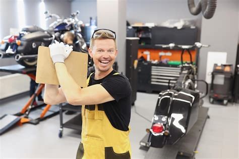 Premium Photo Happy Male Repairman Holding Clipboard With Documents