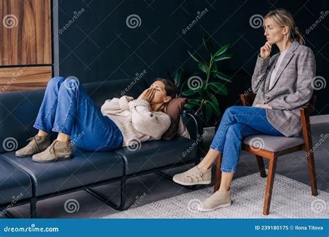 A Crying Woman Lying On A Couch In A Workshop Talks About The Problems
