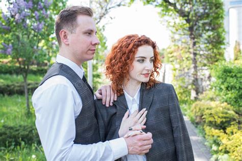 happy redhead husband and wife standing and hugging in nature stock image image of enjoying