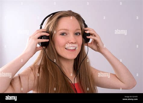 Teenager With Headphones Listening To Music Stock Photo Alamy