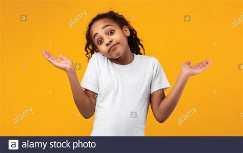 I Dont Know Confused Puzzled Black Girl Shrugging At Studio Stock