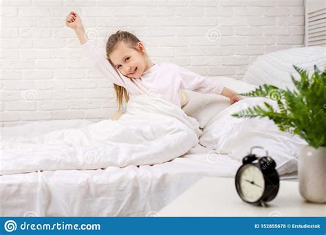 Little Child Girl Wakes Up From Sleep Stock Photo Image Of Morning