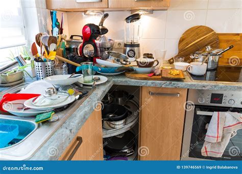 Messy Kitchen Counter With Pile Of Dirty Dishes In Sink Compulsive