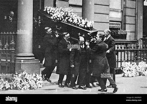 The wreath covered coffin containing Joseph Chamberlain is carried from