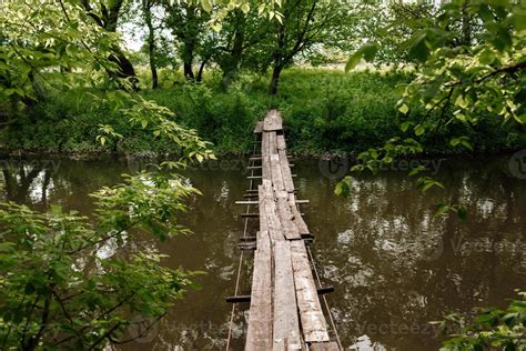 A Small Wooden Bridge Over A Mild Stream In A Green Park 6592236 Stock