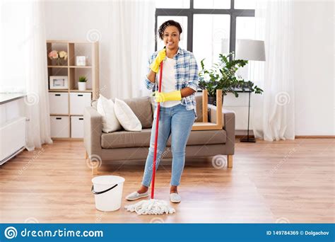 african woman or housewife cleaning floor at home stock image image of domestic indoors
