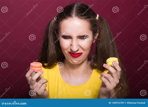 Upset Dieting Brunette Girl With Bright Makeup Holding Macaroons Stock Image Image Of