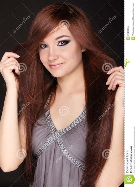 Young Beautiful Woman With Long Brown Magnificent Hair