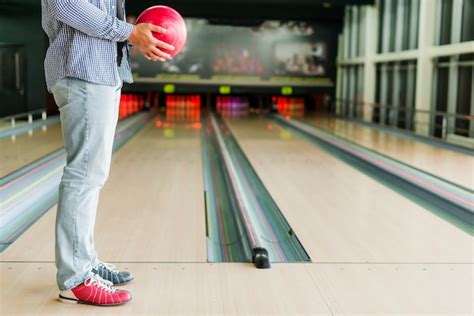 Free Photo Man Holding A Red Bowling Ball