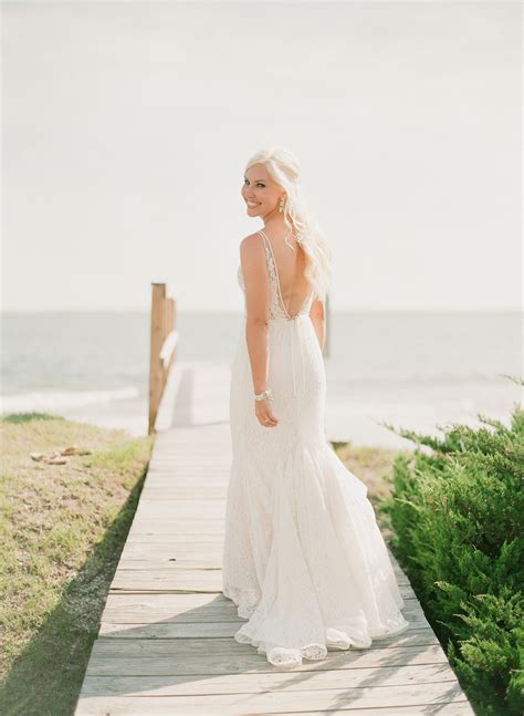 Offering honeymoon excursions such as sunset sails. 27 Stunning Beach Wedding Dresses | Martha Stewart Weddings