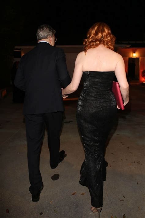 Christina Hendricks And George Bianchini Arrives At A Holiday Party In